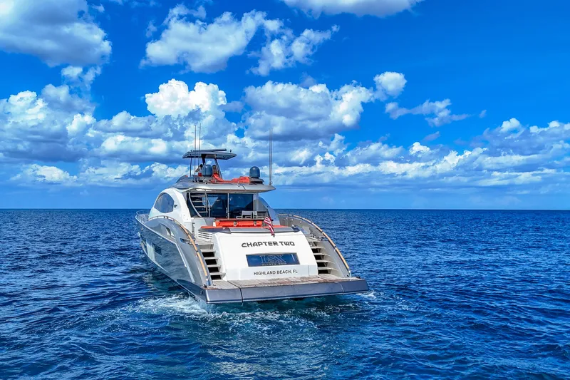  Yacht Photos Pics Luxury yacht Lazzara LSX 92, 2010 model, cruising on open sea under blue sky.