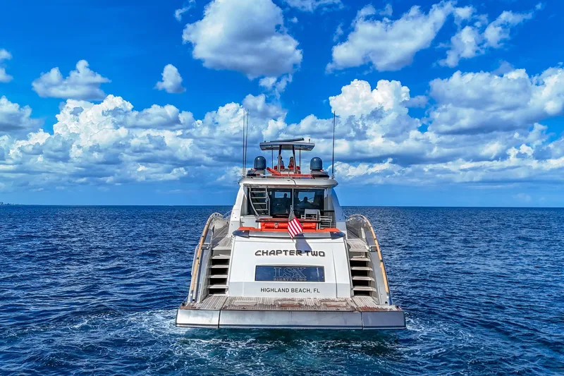  Yacht Photos Pics Luxury 2010 Lazzara LSX 92 yacht cruising on open sea under blue sky.