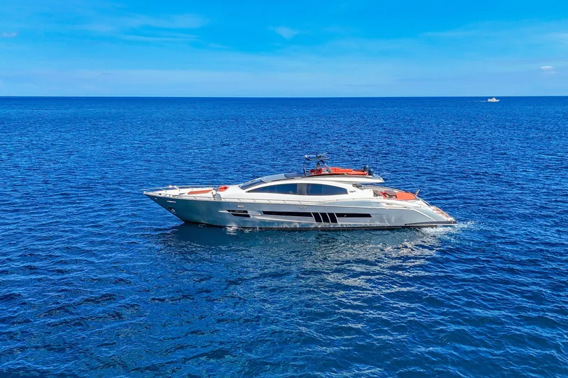  Yacht Photos Pics Luxurious 2010 Lazzara LSX 92 yacht cruising on open blue sea.