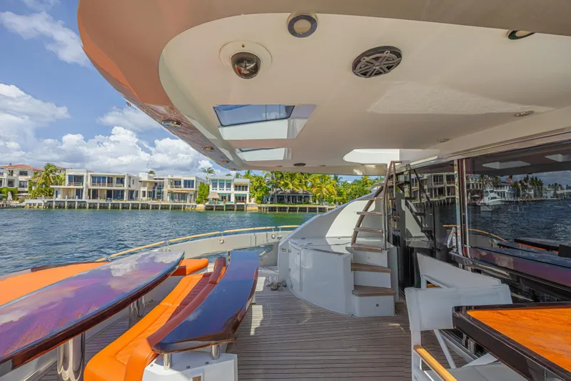  Yacht Photos Pics Luxurious 2010 Lazzara LSX 92 yacht deck with modern seating and waterfront view.