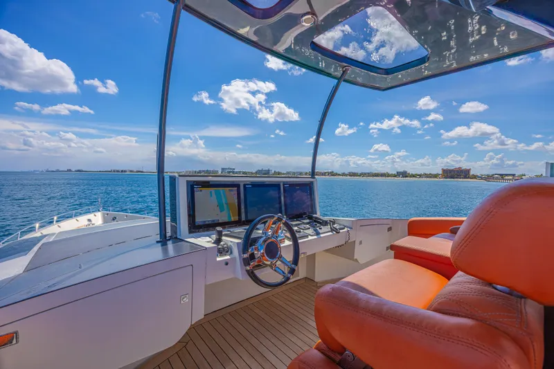  Yacht Photos Pics Luxurious 2010 Lazzara LSX 92 yacht helm with ocean view and modern navigation equipment.