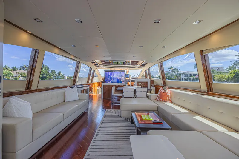  Yacht Photos Pics Luxurious interior of 2010 Lazzara LSX 92 yacht with elegant seating and panoramic windows.