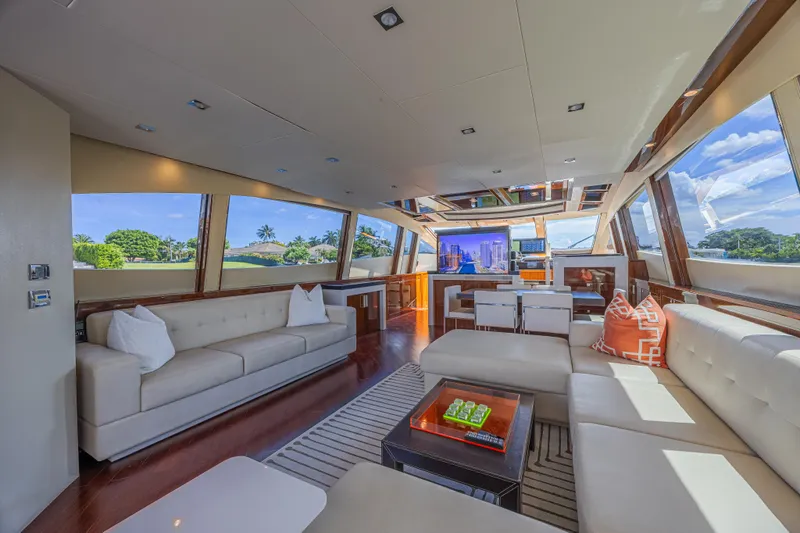  Yacht Photos Pics Luxurious interior of 2010 Lazzara LSX 92 yacht with modern furnishings and panoramic windows.