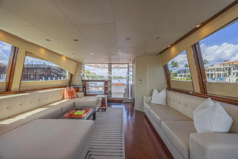  Yacht Photos Pics Luxurious interior of 2010 Lazzara LSX 92 yacht with elegant seating and panoramic windows.