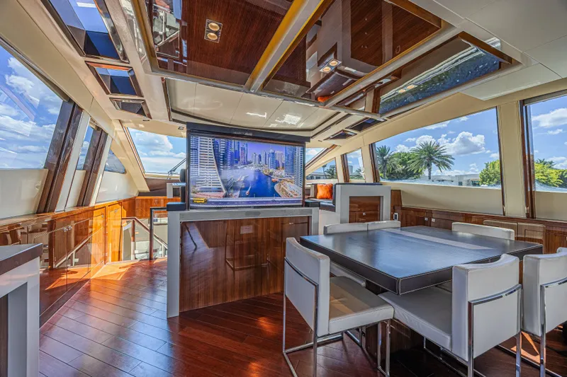  Yacht Photos Pics Luxurious interior of 2010 Lazzara LSX 92 yacht with modern dining area and large windows.