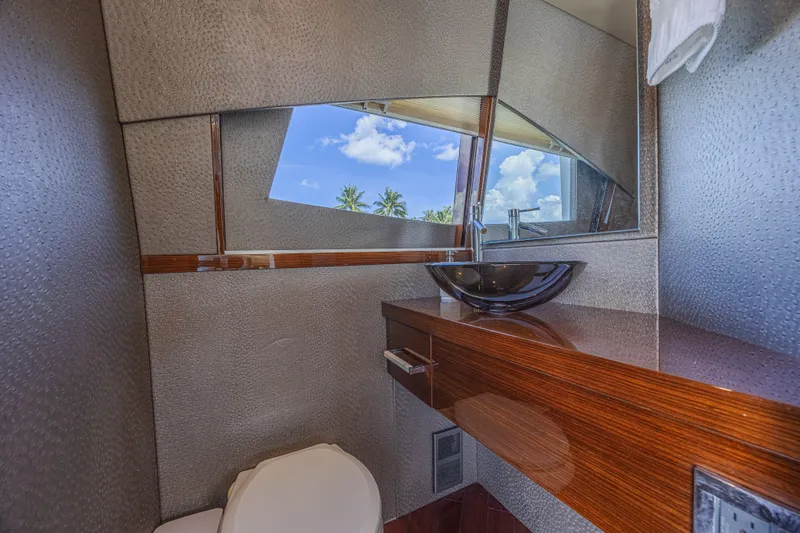  Yacht Photos Pics Luxurious bathroom interior of 2010 Lazzara LSX 92 yacht with modern fixtures and ocean view.