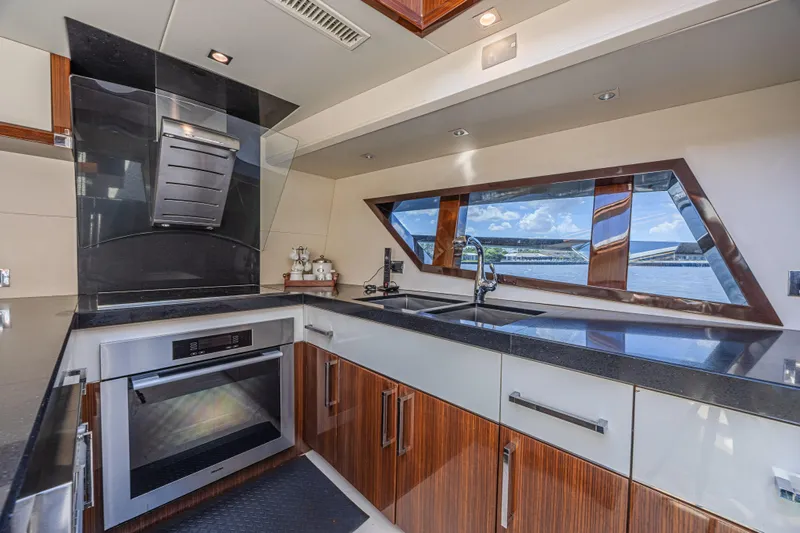  Yacht Photos Pics Modern kitchen interior on 2010 Lazzara LSX 92 yacht with sleek design and ocean view.