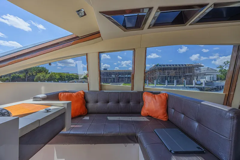  Yacht Photos Pics Luxurious interior of 2010 Lazzara LSX 92 yacht with leather seating and scenic windows.