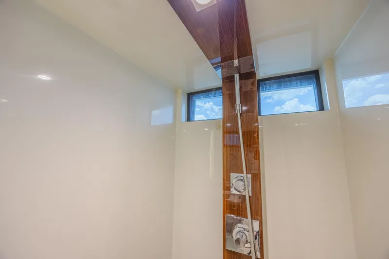  Yacht Photos Pics Luxurious shower interior on 2010 Lazzara LSX 92 yacht with modern fixtures and skylight.