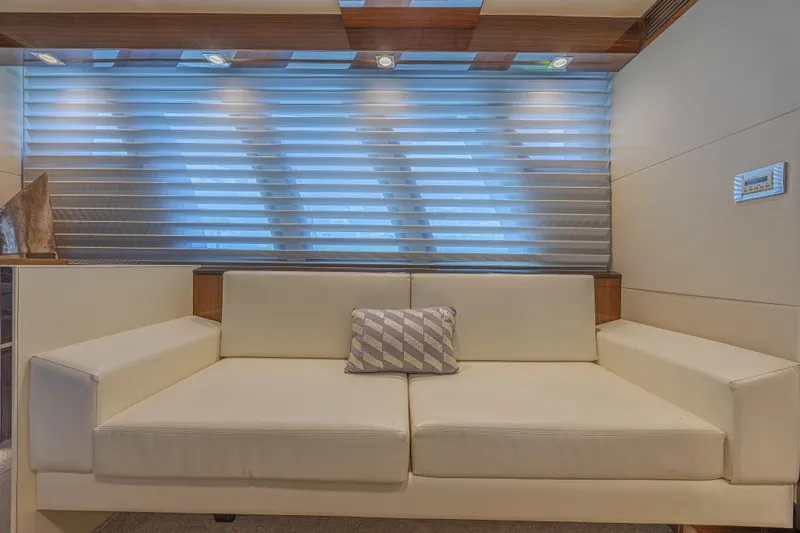  Yacht Photos Pics Luxurious interior of 2010 Lazzara LSX 92 yacht with modern white sofa and decorative pillow.