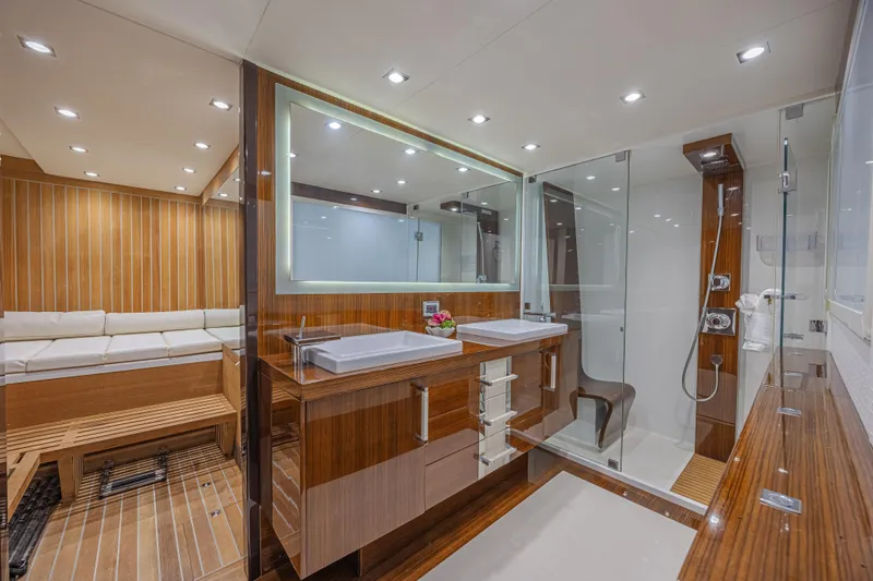  Yacht Photos Pics Luxurious bathroom interior of 2010 Lazzara LSX 92 yacht with modern fixtures and wood accents.