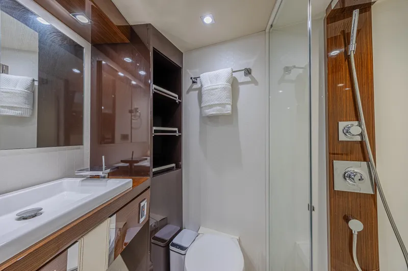  Yacht Photos Pics Luxurious bathroom in 2010 Lazzara LSX 92 yacht with modern fixtures and elegant design.