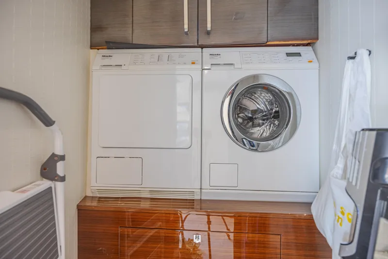 Yacht Photos Pics Laundry area with Miele washer and dryer on Lazzara LSX 92 yacht, 2010 model.