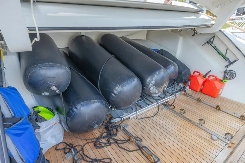  Yacht Photos Pics Storage area on 2010 Lazzara LSX 92 yacht with fenders and fuel containers.