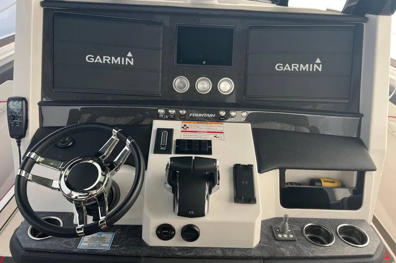  Yacht Photos Pics 2025 Fountain 38 SCX boat dashboard with Garmin displays and modern controls.