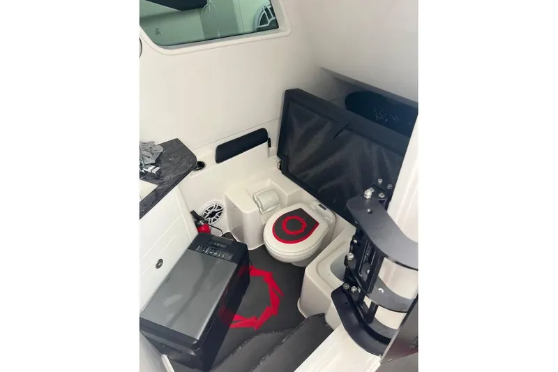  Yacht Photos Pics 2025 Fountain 38 SCX boat interior with compact bathroom and modern amenities.