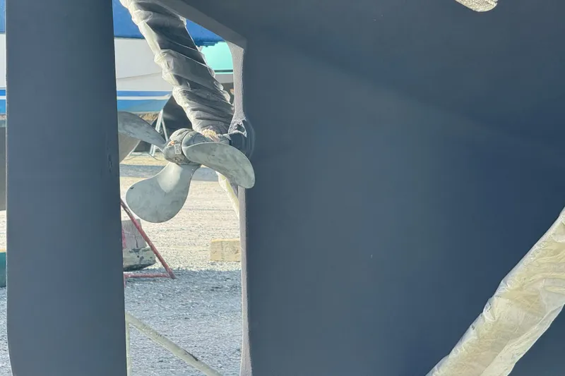 Buena Vida Yacht Photos Pics Propeller of 2000 Island Packet 380 sailboat in dry dock, wrapped for protection.