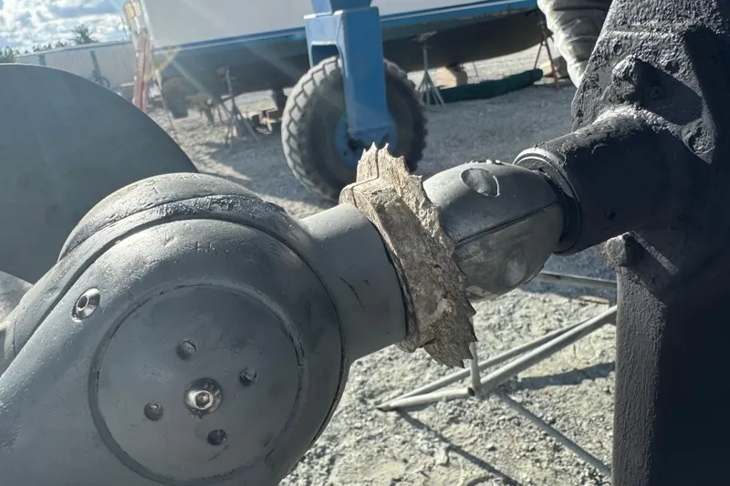 Buena Vida Yacht Photos Pics Close-up of Island Packet 380 propeller shaft with marine growth, 2000 model.