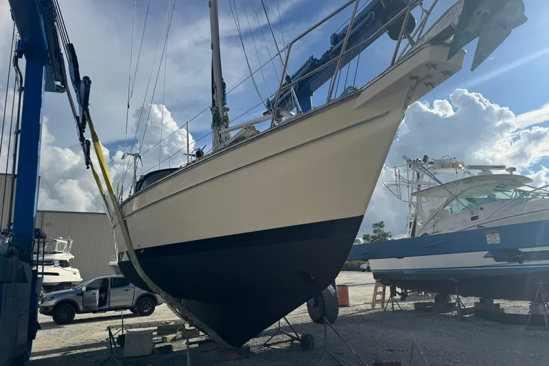 Buena Vida Yacht Photos Pics Sailboat Island Packet 380, 2000 model, in dry dock with blue sky background.