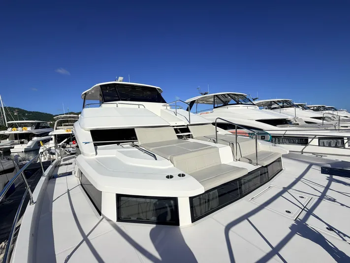 Grace Yacht Photos Pics Luxury yacht Aquila 54, 2022 model, docked under clear skies.