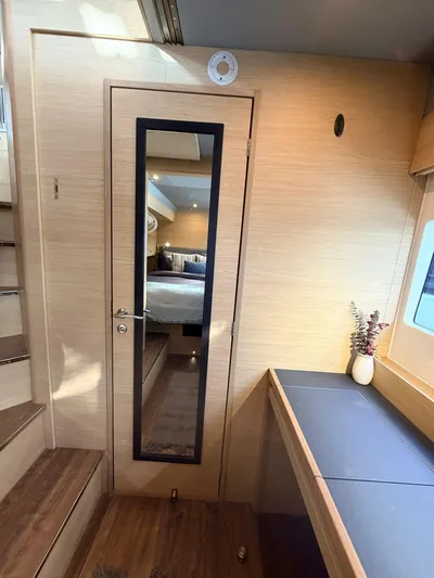 Grace Yacht Photos Pics Interior of 2022 Aquila 54 yacht with mirror and desk.