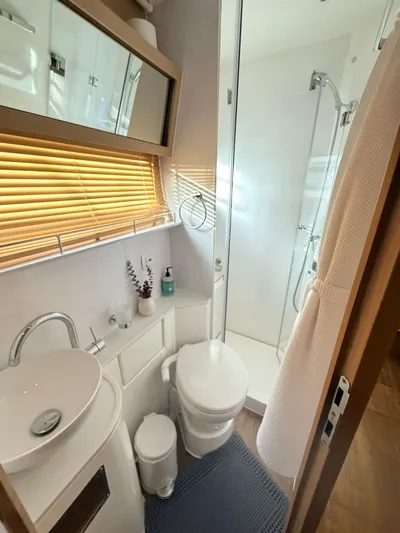 Grace Yacht Photos Pics Modern bathroom in a 2022 Aquila 54 yacht.