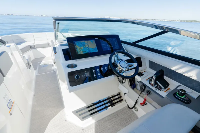  Yacht Photos Pics 2023 Sea Ray SLX 310 Outboard helm with modern controls and navigation display.