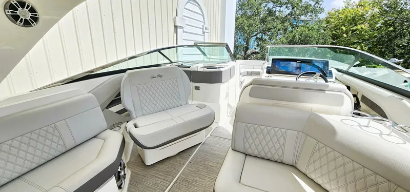  Yacht Photos Pics 2023 Sea Ray SLX 310 Outboard interior with luxurious seating and modern dashboard.