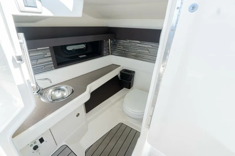  Yacht Photos Pics 2023 Sea Ray SLX 310 Outboard interior with sink, toilet, and modern design.