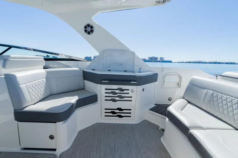 Yacht Photos Pics Luxurious interior of 2023 Sea Ray SLX 310 Outboard with elegant seating and ocean view.