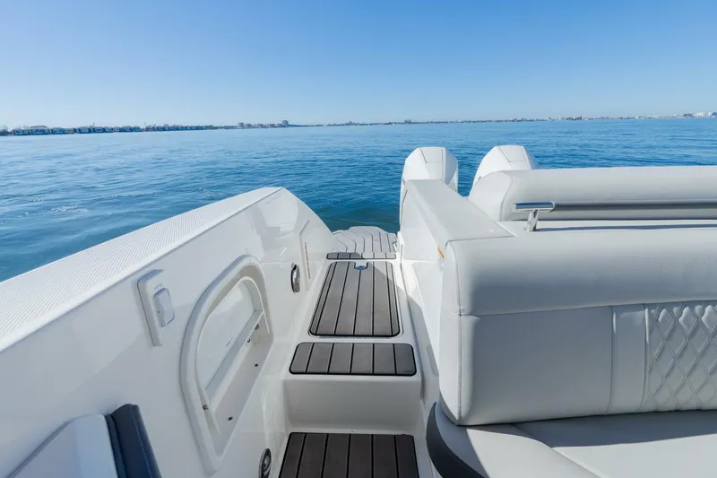  Yacht Photos Pics 2023 Sea Ray SLX 310 Outboard boat interior with luxurious seating and ocean view.
