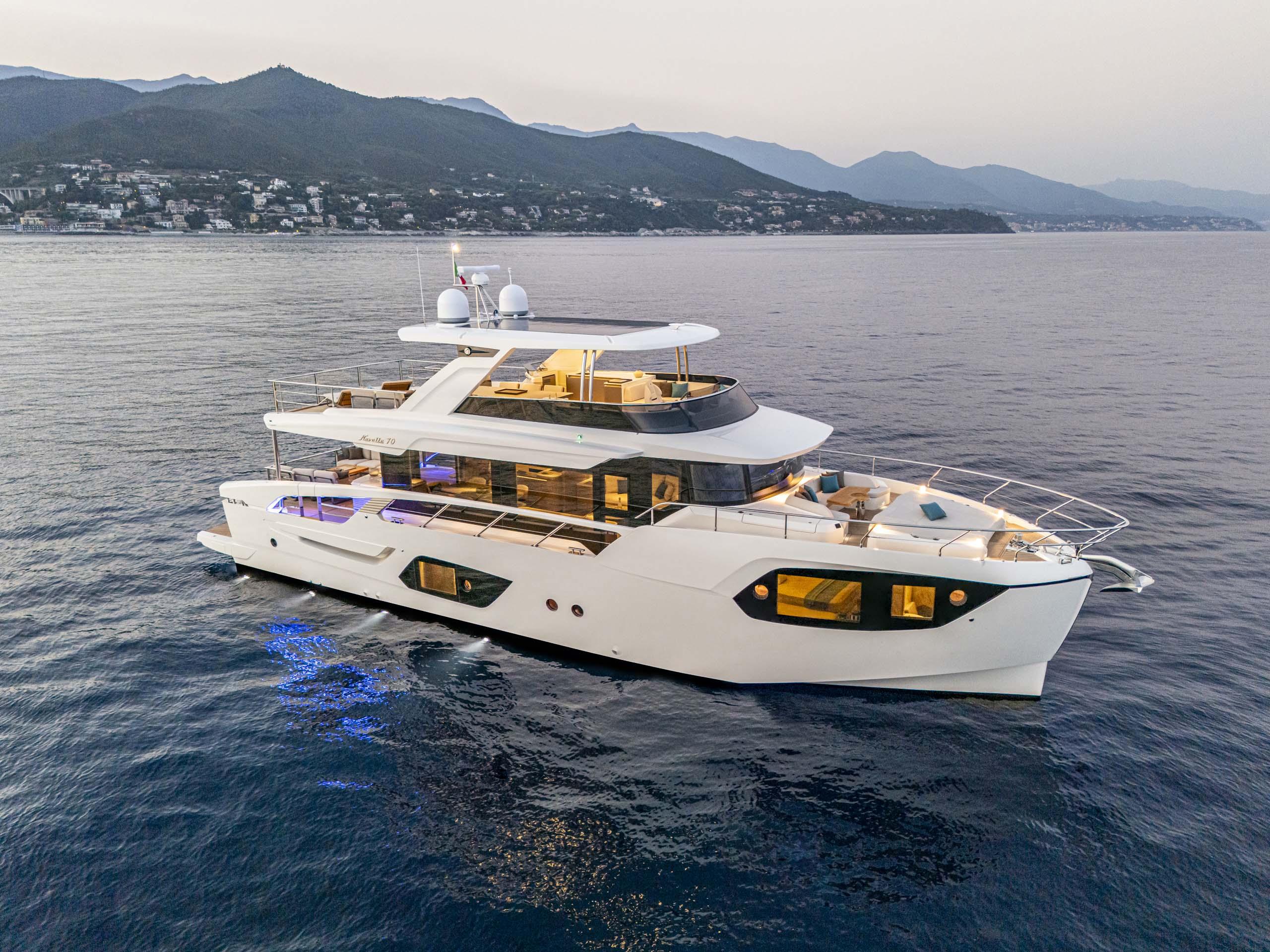 Luxurious 2026 Absolute 70 N yacht on serene waters, showcasing elegant design and modern amenities.