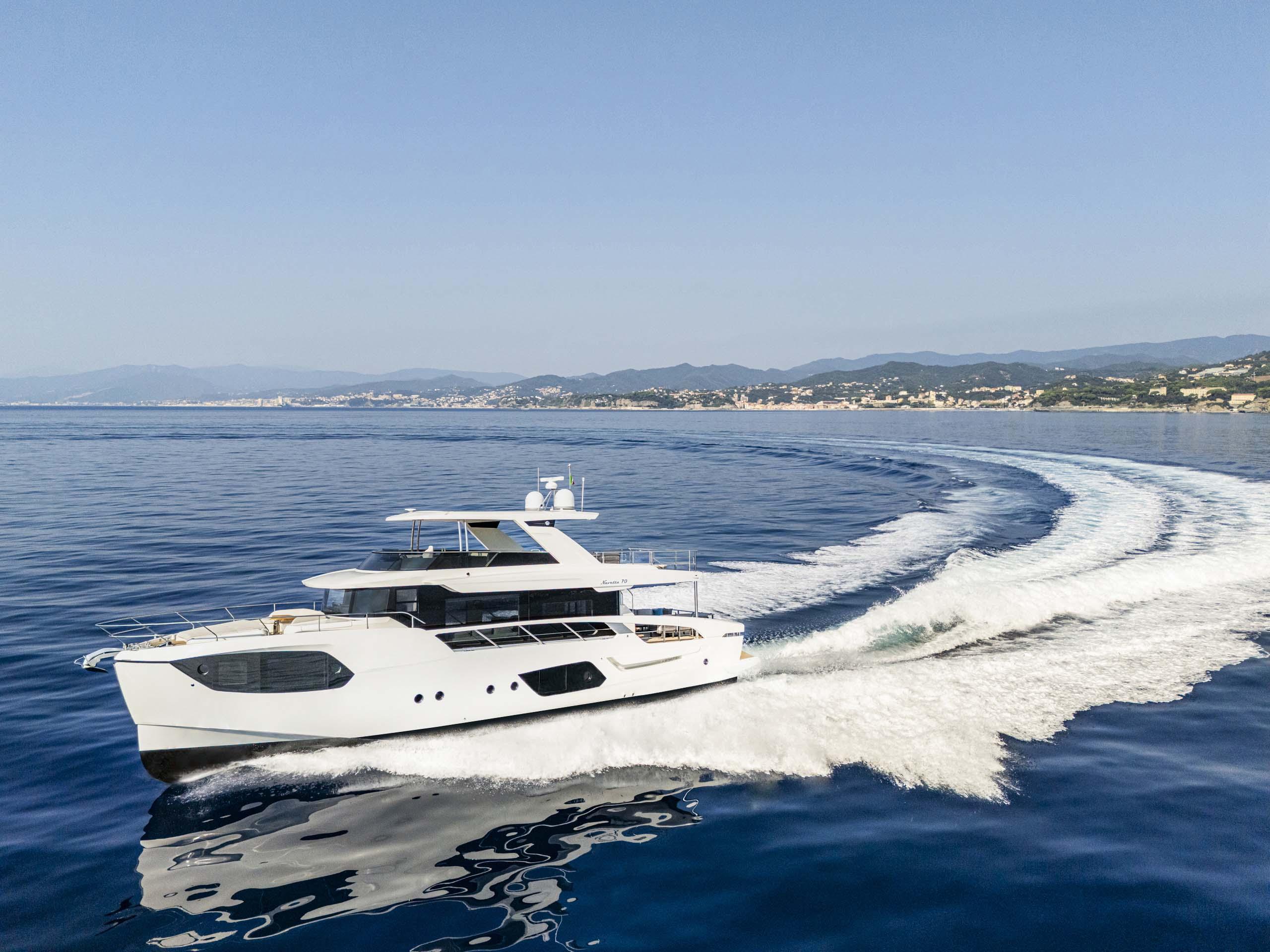 Luxury Absolute 70 N yacht cruising on open sea, 2026 model, showcasing fractional ownership.