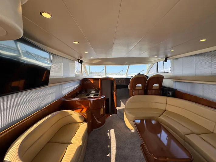  Yacht Photos Pics Luxurious interior of 2005 Viking Princess 50 Flybridge yacht with elegant seating and panoramic windows.