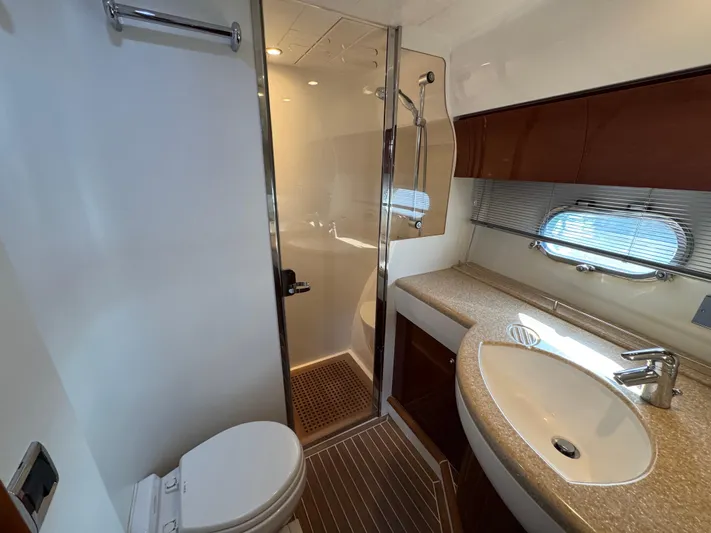 Yacht Photos Pics Luxurious bathroom in 2005 Viking Princess 50 Flybridge yacht with shower and modern fixtures.