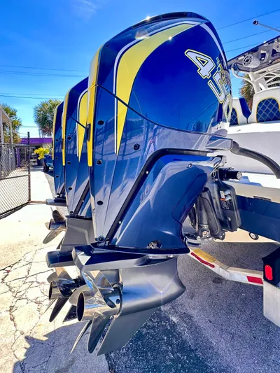  Yacht Photos Pics 2022 Midnight Express 37 Open with powerful outboard engines, showcasing sleek design and performance.