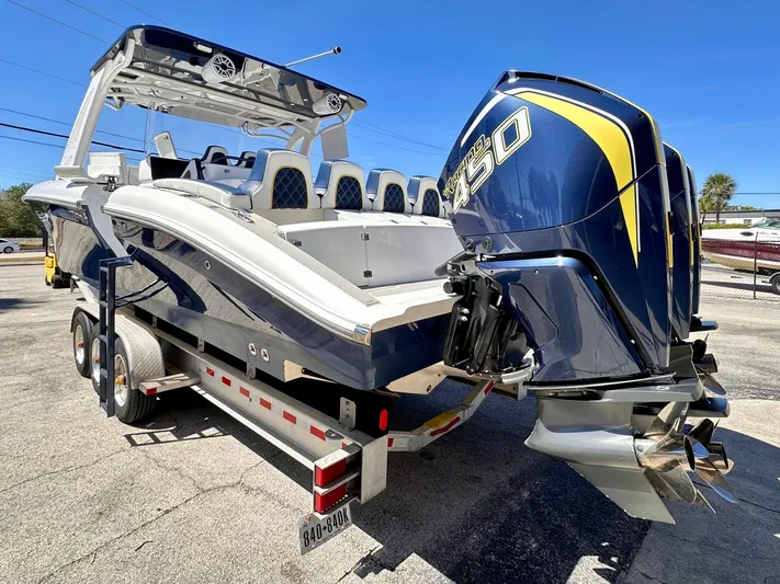  Yacht Photos Pics 2022 Midnight Express 37 Open boat with powerful outboard engine on a trailer.