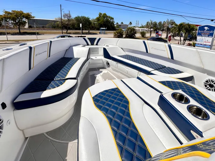  Yacht Photos Pics Luxurious 2022 Midnight Express 37 Open boat interior with blue and white seating.