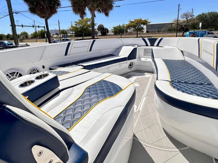  Yacht Photos Pics Luxurious seating on 2022 Midnight Express 37 Open boat, featuring blue and white upholstery.