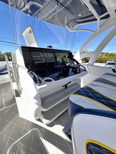  Yacht Photos Pics 2022 Midnight Express 37 Open boat interior with modern dashboard and seating.
