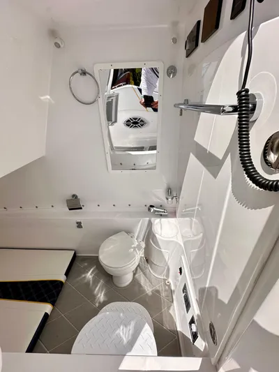  Yacht Photos Pics 2022 Midnight Express 37 Open boat interior with modern bathroom amenities.