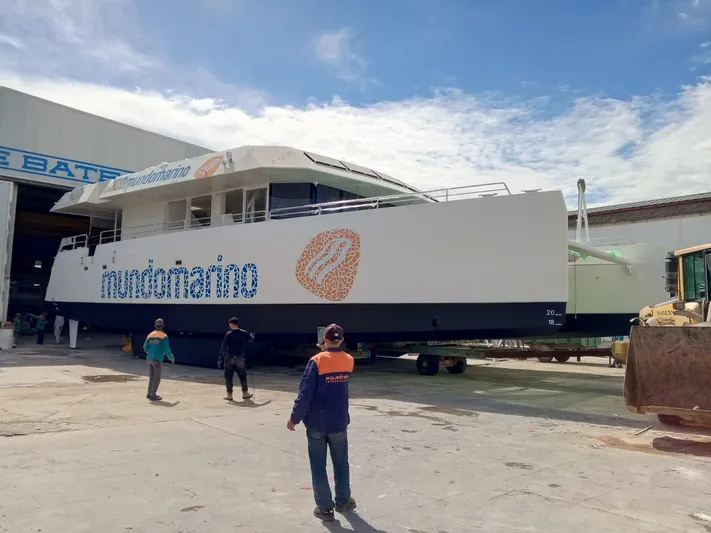  Yacht Photos Pics Squalt Marine CK 80 catamaran, 2025 model, in shipyard with workers and machinery.