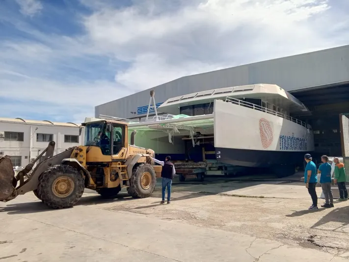  Yacht Photos Pics A Squalt Marine CK 80 yacht being moved by a loader outside a warehouse, 2025 model.