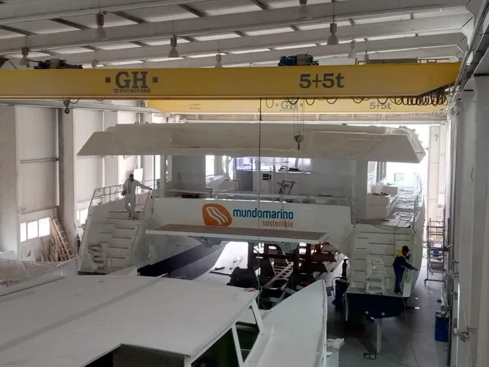  Yacht Photos Pics Interior view of a shipyard with a 2025 Squalt Marine CK 80 under construction.