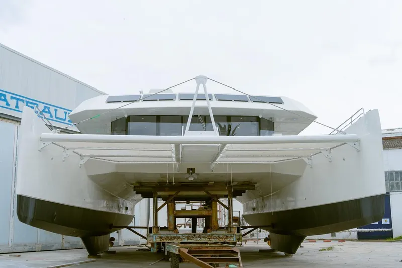  Yacht Photos Pics Front view of 2025 Squalt Marine CK 80 catamaran in shipyard.