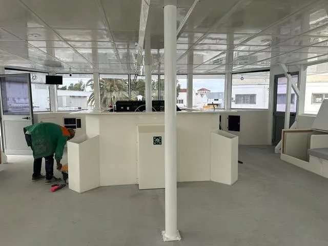  Yacht Photos Pics Modern interior of 2025 Squalt Marine CK 80 boat with worker cleaning.