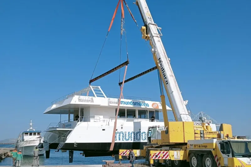  Yacht Photos Pics Crane lifting Squalt Marine CK 80 yacht, 2025 model, at a dockside location.