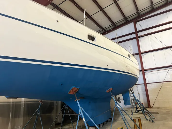 Here Be Dragons Yacht Photos Pics Oyster 46.5 sailboat from 1987 in a storage facility.