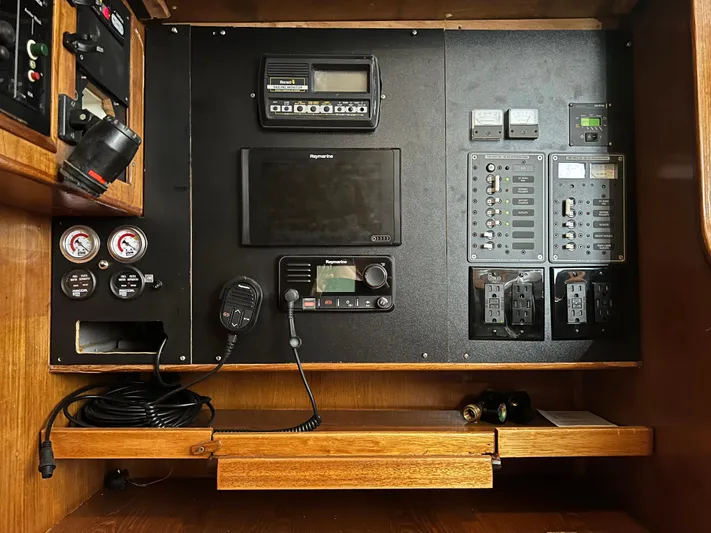 Here Be Dragons Yacht Photos Pics Control panel of a 1987 Oyster 46.5 yacht with navigation and communication equipment.