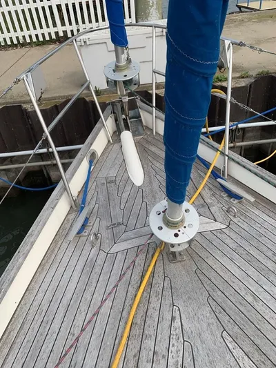 Here Be Dragons Yacht Photos Pics 1987 Oyster 46.5 sailboat deck with blue sail covers and mooring lines.